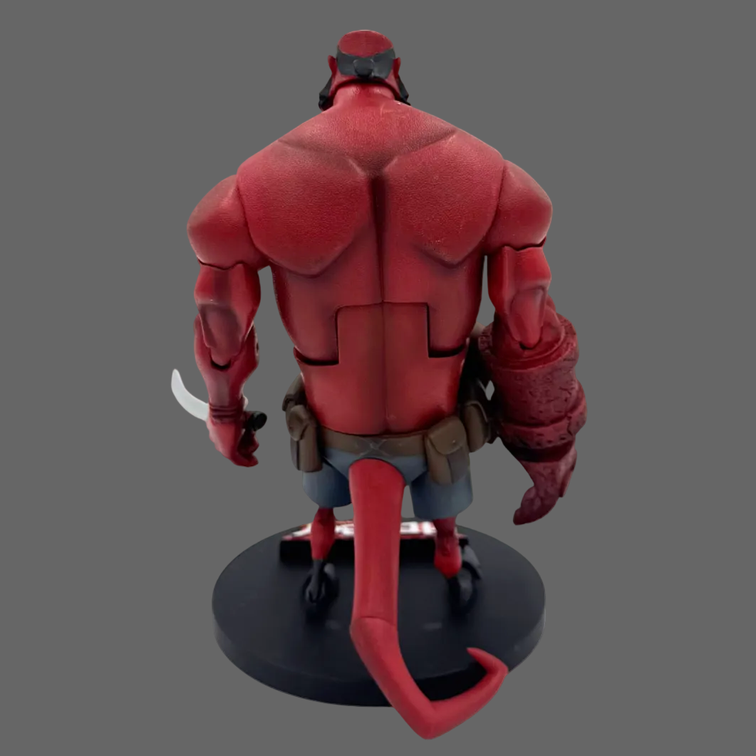 Hellboy figurine shown from the back, standing on a round black base against a plain white background.